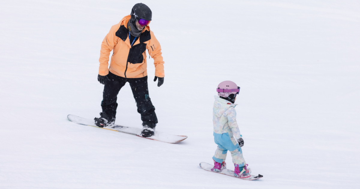 family snowboarding parent child