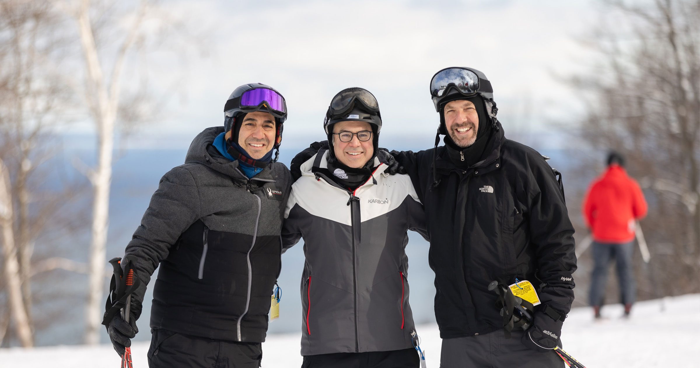 member-with-guests-skiing