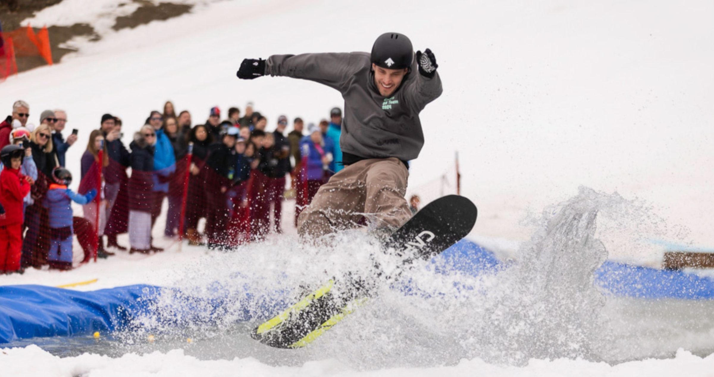 pond-skim-snowboarder