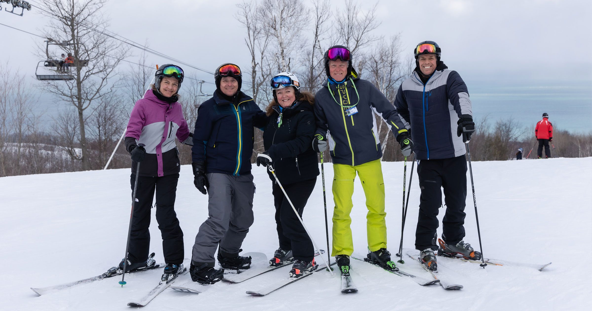 skiers-smiling-top-of-hill